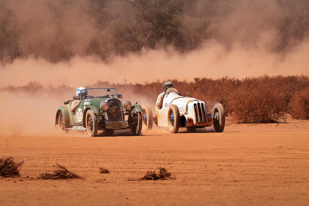 Craig Atkin’s 1939 Morgan tussles with Jack Del Borrello’s 1939 Ford 10 Special. It is the Red Dust Revival, held on the dry claypan of Lake Perkolilli, which lays claim to having been the most remote race circuit in the world and one of Australia’s oldest. Photo Des Lewis. History OUTBACK #Issue 129.