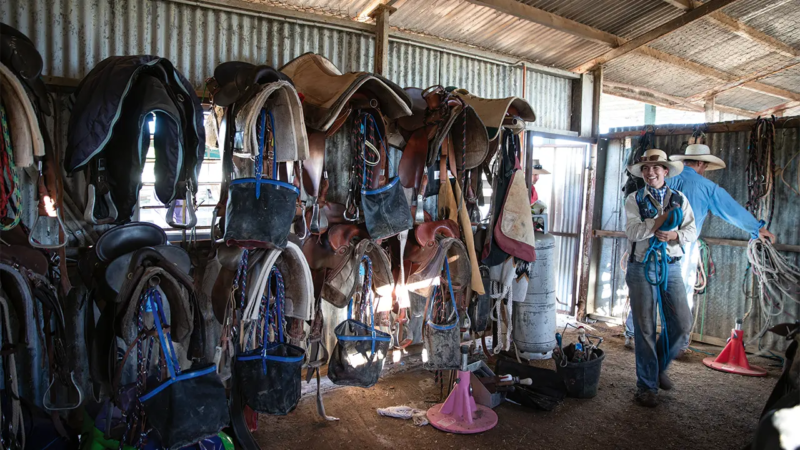 Ringer Bonnie Nugent and John Lutvey return gear to the tack room on Anthony Lagoon station. Photo by David Kelly.