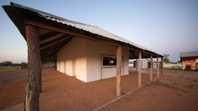 The shady verandah protects the earthen walls of this historic pisé house in Bedourie, Qld.